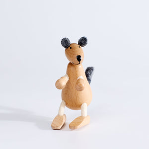 A wooden toy kangaroo with plush fabric and rope, standing upright on a white background.