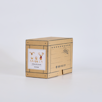 Cardboard box with a label featuring illustrations of deer on a white background